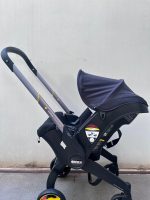 Xe đẩy kết hợp ghế ngồi ô tô Doona màu đen, tặng kèm đệm xe đẩy và miếng lót ô tô (1,8→13,6kg, còn túi đựng) - Ảnh 28