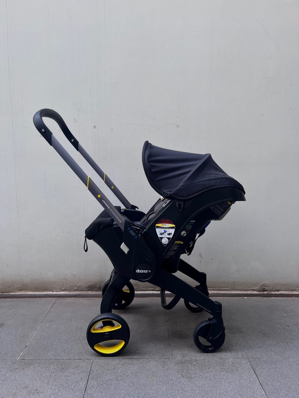 Xe đẩy kết hợp ghế ngồi ô tô Doona màu đen, tặng kèm đệm xe đẩy và miếng lót ô tô (1,8→13,6kg, còn túi đựng) - Ảnh 19