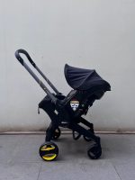 Xe đẩy kết hợp ghế ngồi ô tô Doona màu đen, tặng kèm đệm xe đẩy và miếng lót ô tô (1,8→13,6kg, còn túi đựng) - Ảnh 19