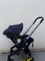 Xe đẩy kết hợp ghế ngồi ô tô Doona màu đen, tặng kèm đệm xe đẩy và miếng lót ô tô (1,8→13,6kg, còn túi đựng) - Ảnh 16