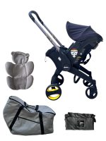 Xe đẩy kết hợp ghế ngồi ô tô Doona màu đen, tặng kèm đệm xe đẩy và miếng lót ô tô (1,8→13,6kg, còn túi đựng)